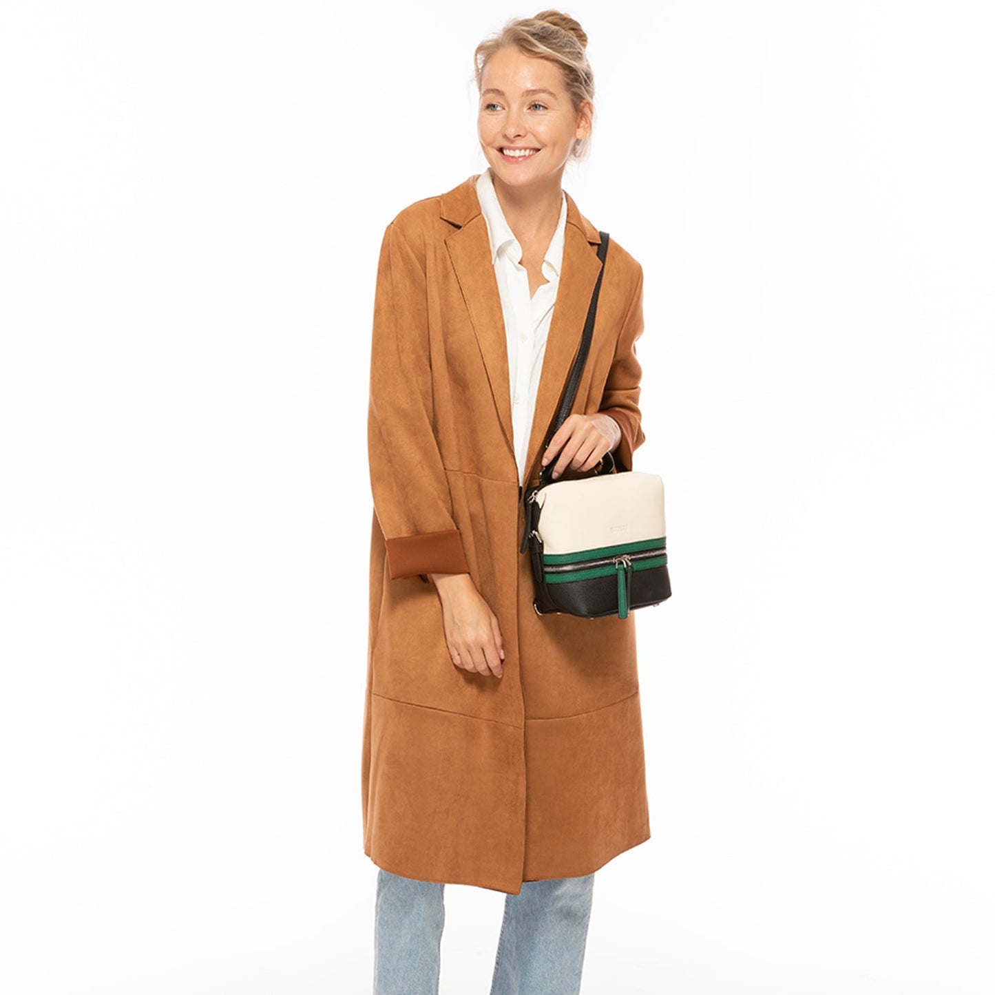 SUSU Ashley backpack worn as convertible crossbody bag with adjustable straps