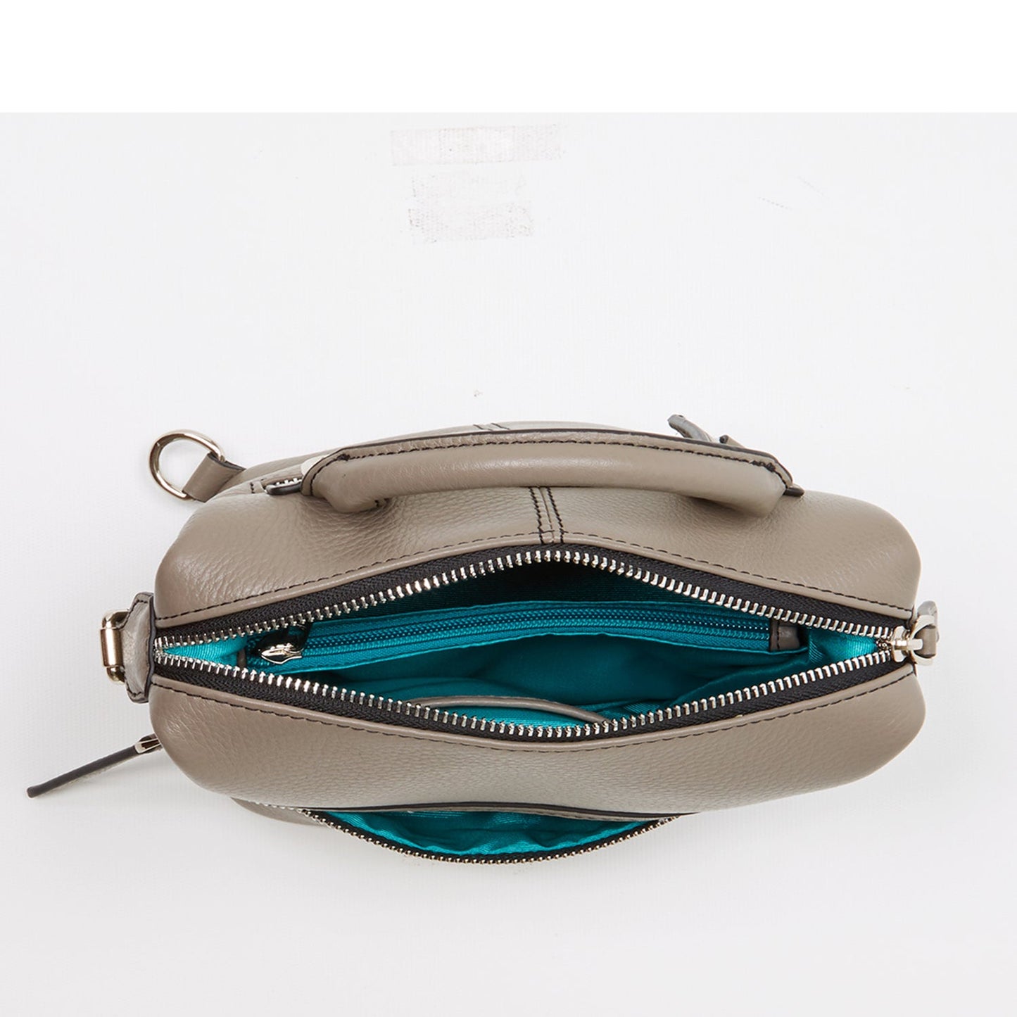 SUSU grey leather backpack interior view with turquoise fabric lining and compartments