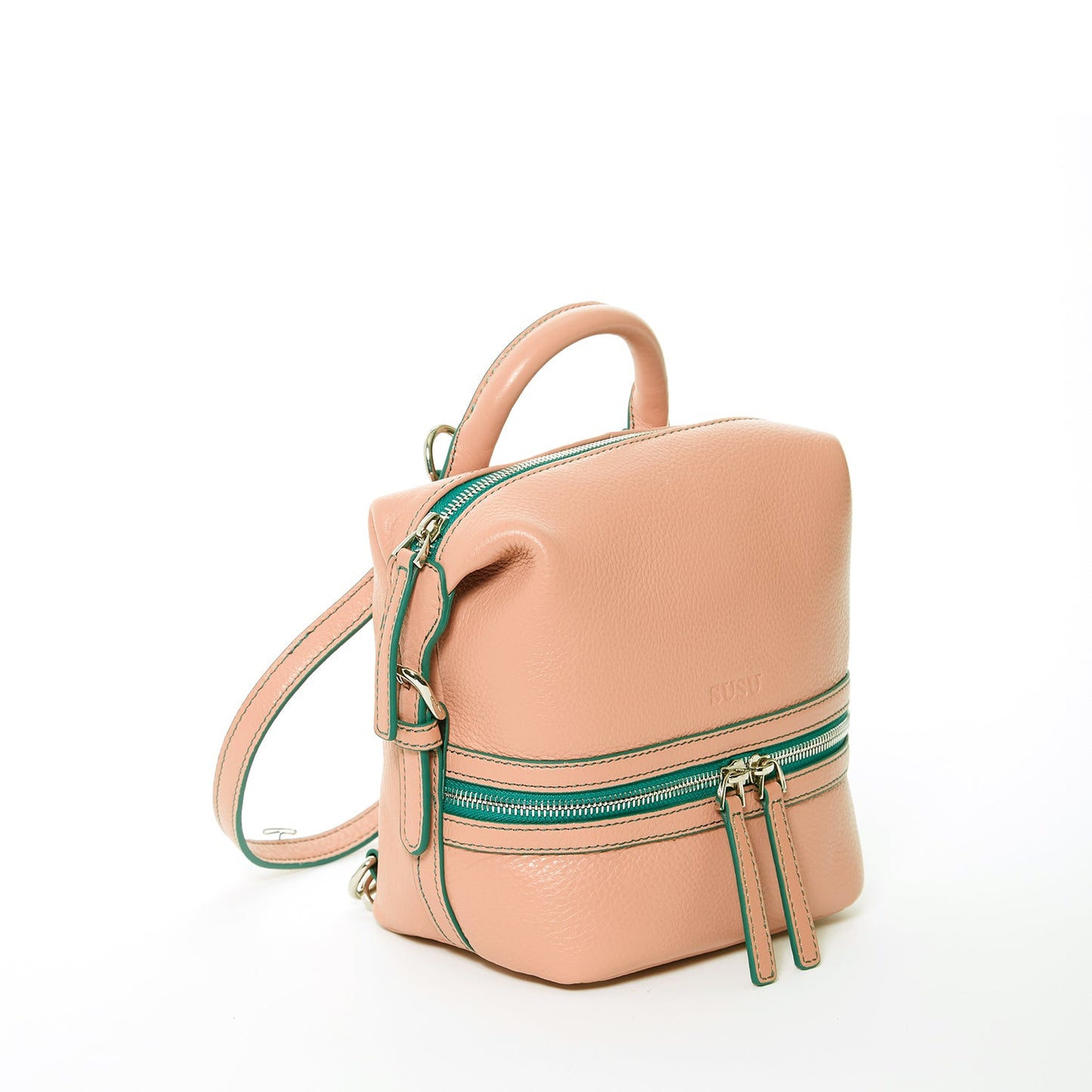 SUSU Ashley sand tone pink leather backpack showing green silver zippers and tassel details