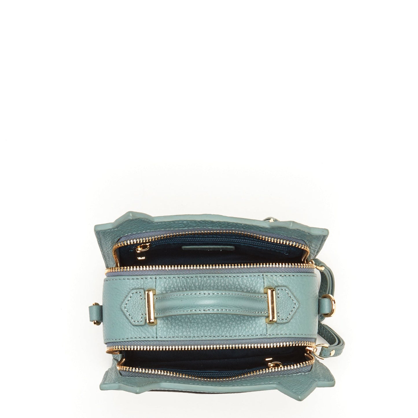 SUSU leather cat bag interior showing teal lining and zippered pocket organization