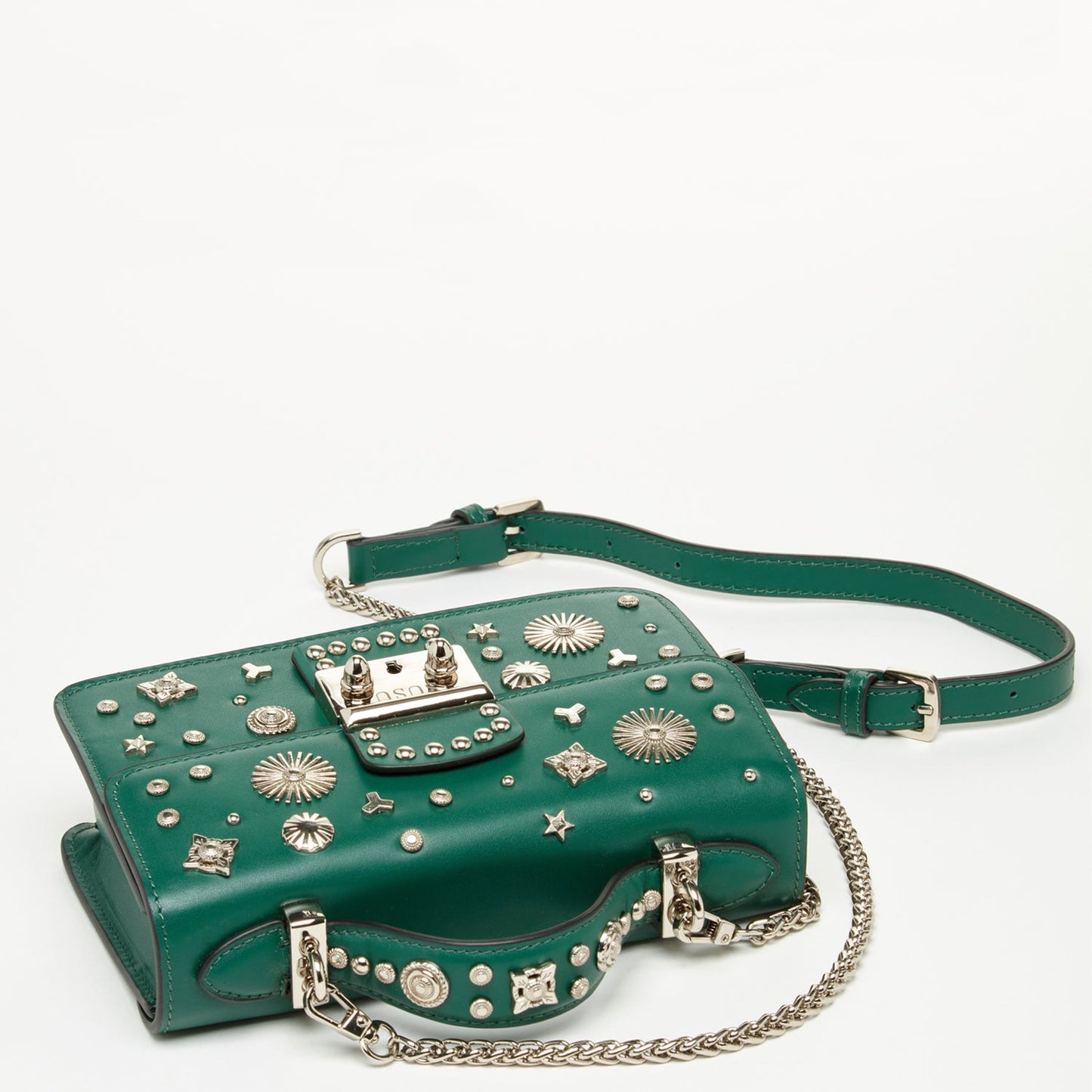 Close-up of SUSU dark green leather bag studded detailing and silver-tone hardware
