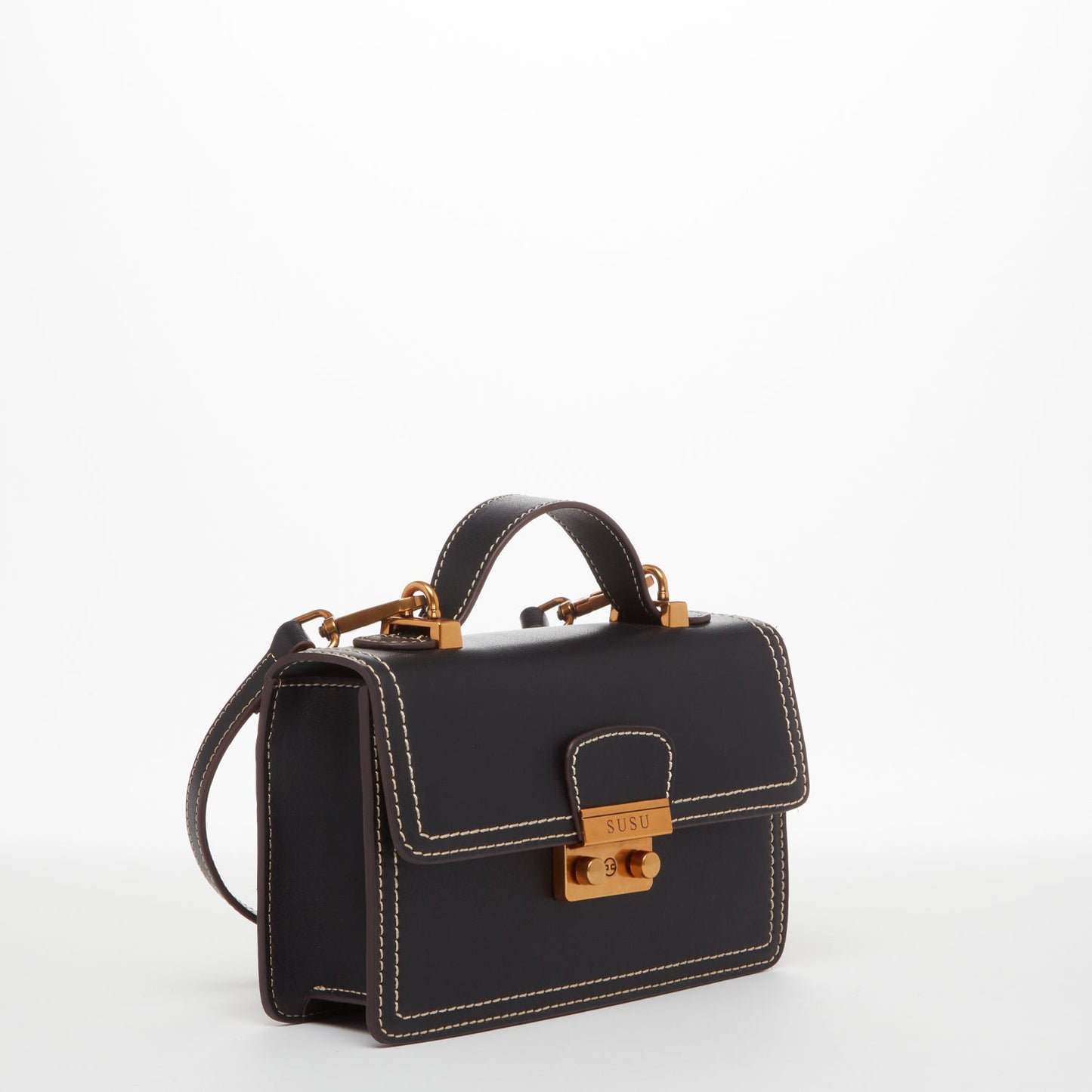 SUSU black crossbody purse demonstrating secure buckle closure