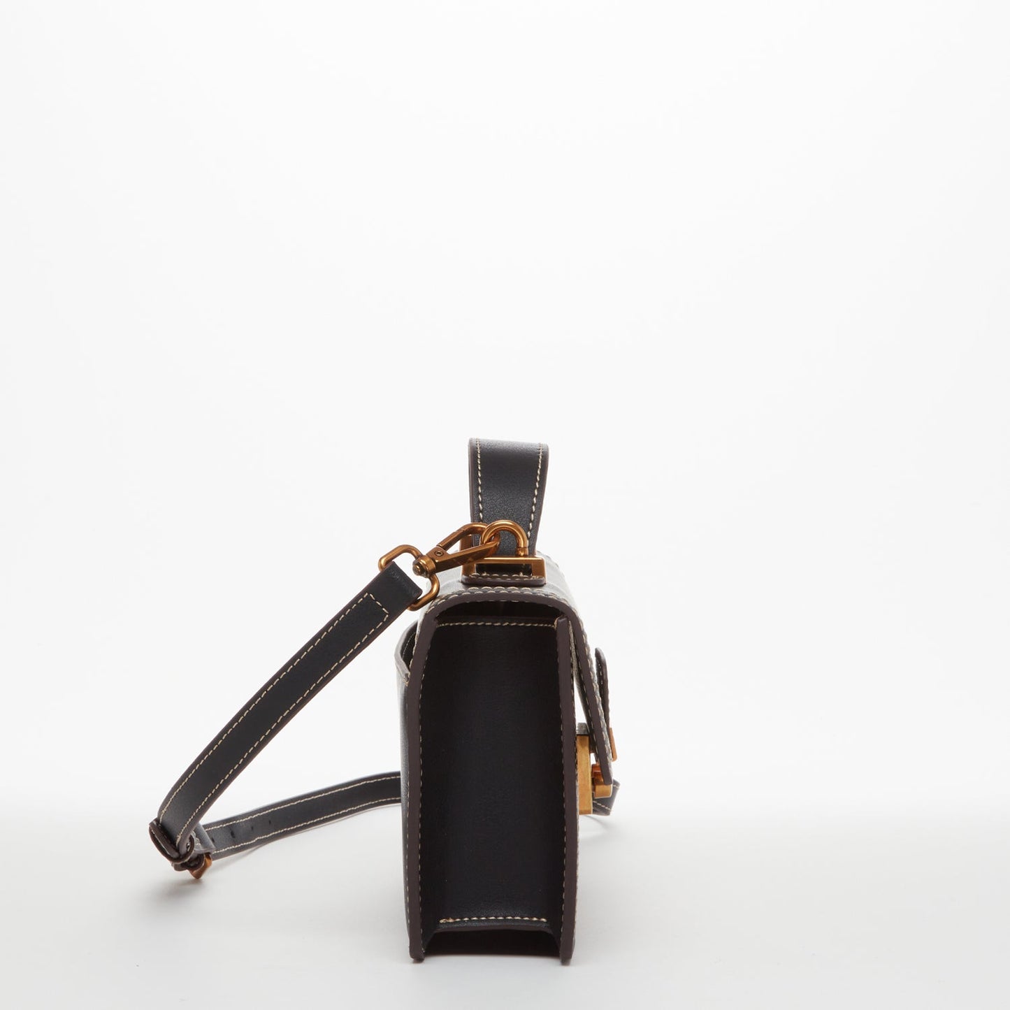 SUSU black leather bag showing minimalist chic design and compact size
