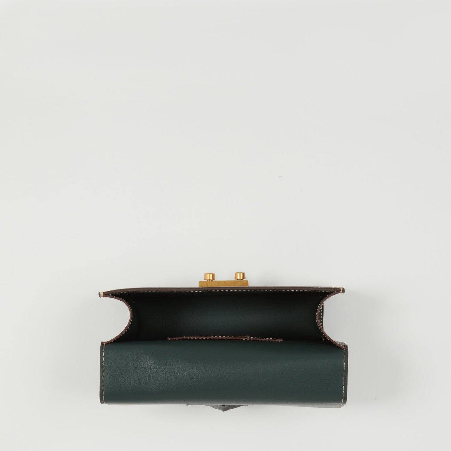 SUSU black leather bag showing interior pocket and organizational features