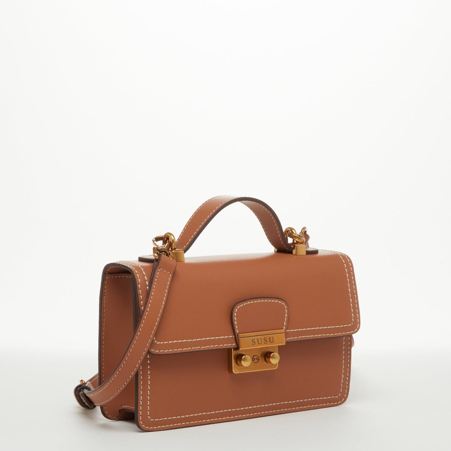 SUSU brown leather crossbody purse demonstrating sleek modern design