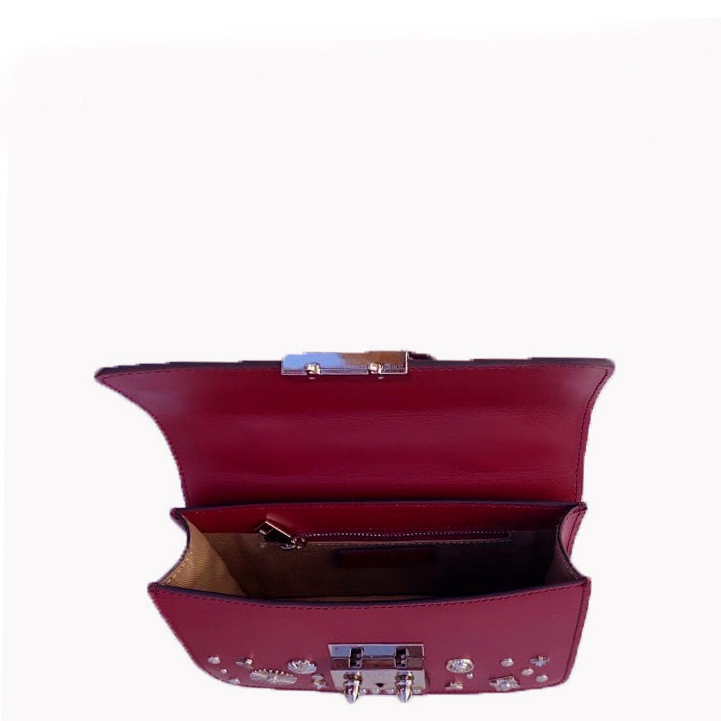 SUSU burgundy crossbody bag open showing compact interior storage capacity