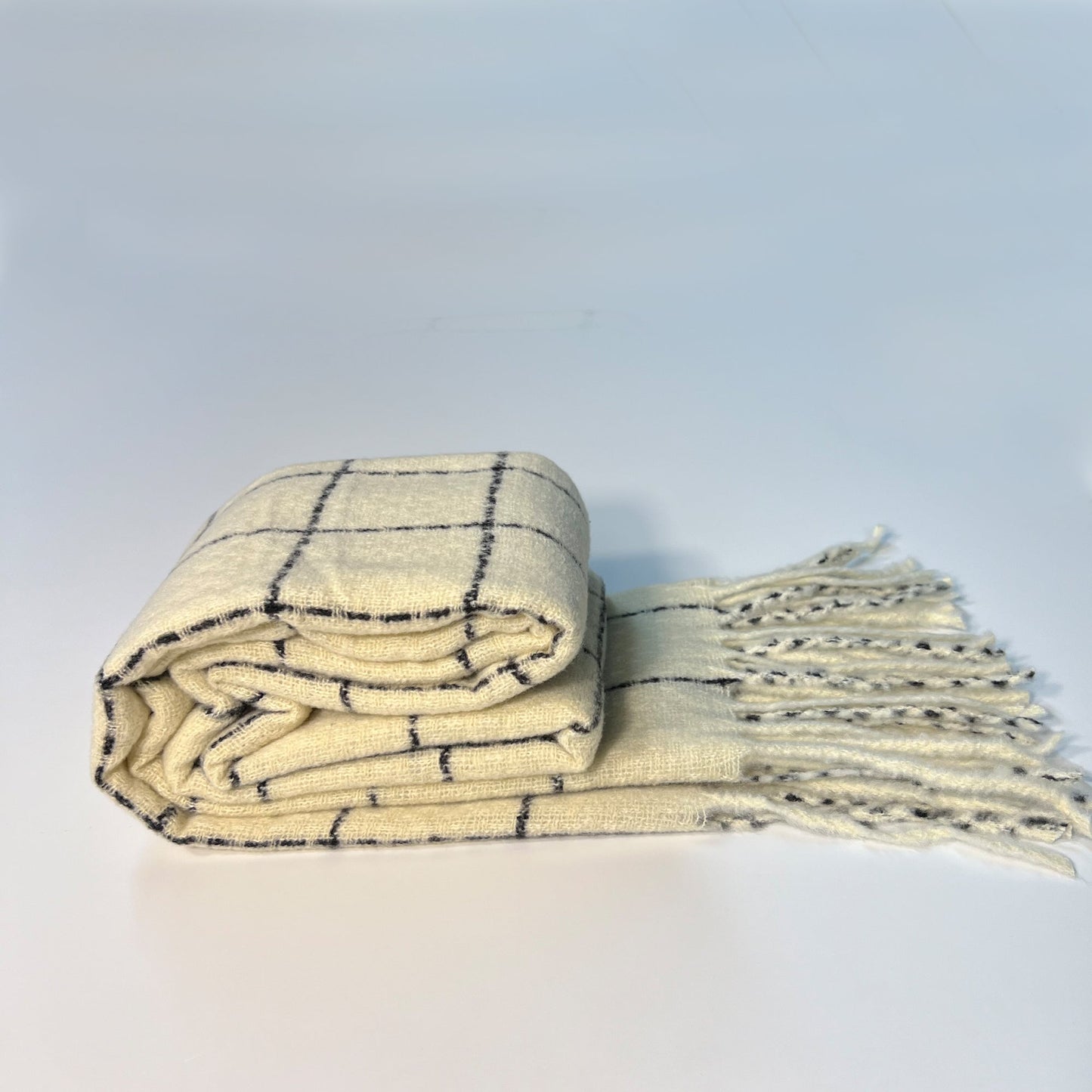 SUSU plaid scarf folded showing 80 inch length and 25 inch width dimensions