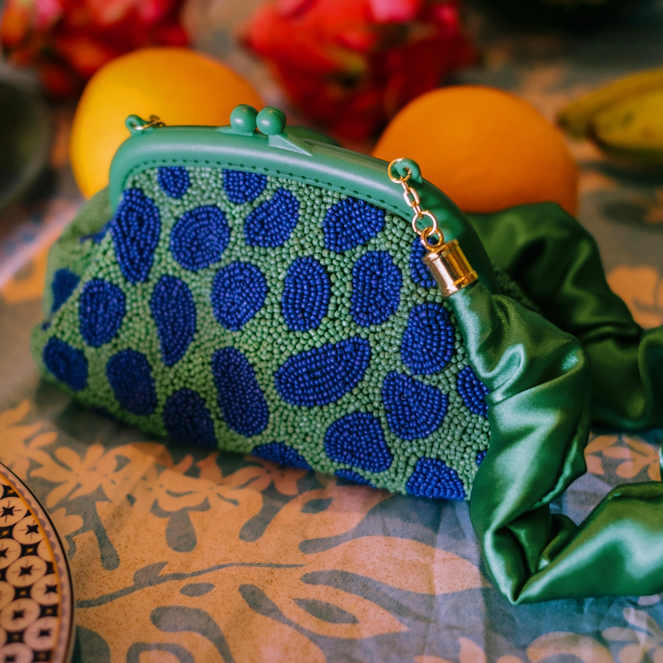 the Arnoldi Jade Clutch Bag In Lush Green & Blue BrunnaCo