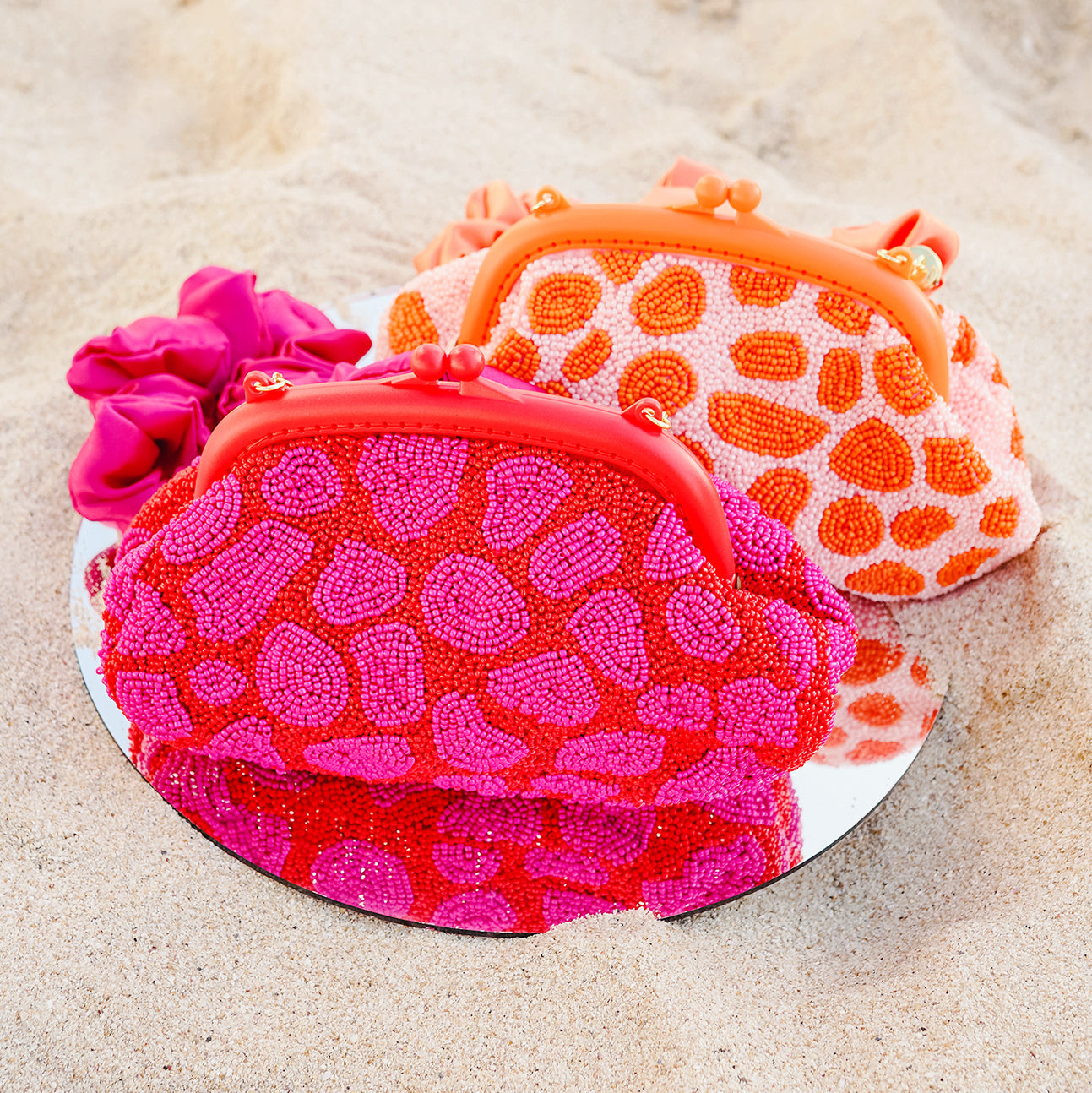 The Arnoldi Jean Hand-beaded Clutch, in Red & Pink BrunnaCo