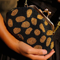 The Arnoldi Black Gold Hand - beaded Clutch In Black & Gold - Diazza