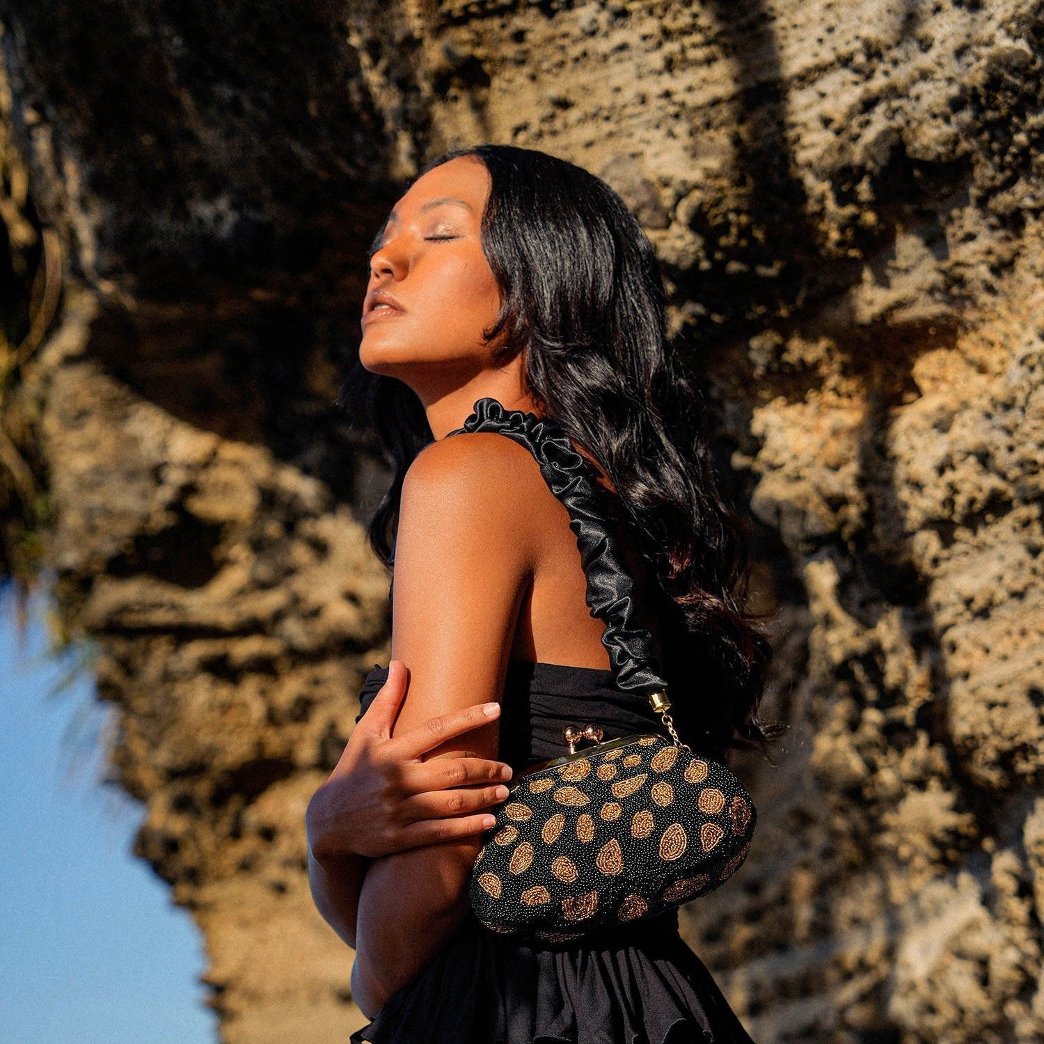 The Arnoldi Black Gold Hand - beaded Clutch In Black & Gold - Diazza
